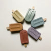 Set of colorful concrete  popsicle-shaped cookies on a white background